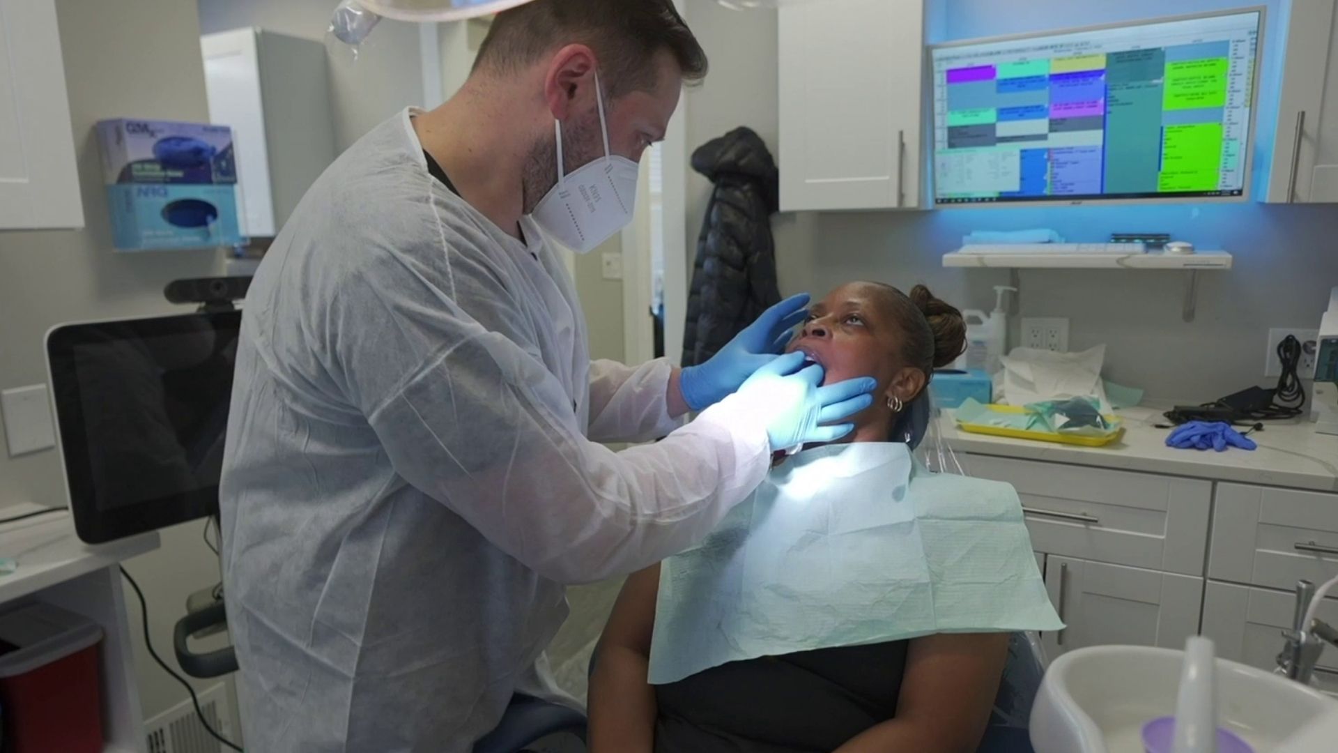 dentist examines full arch patient